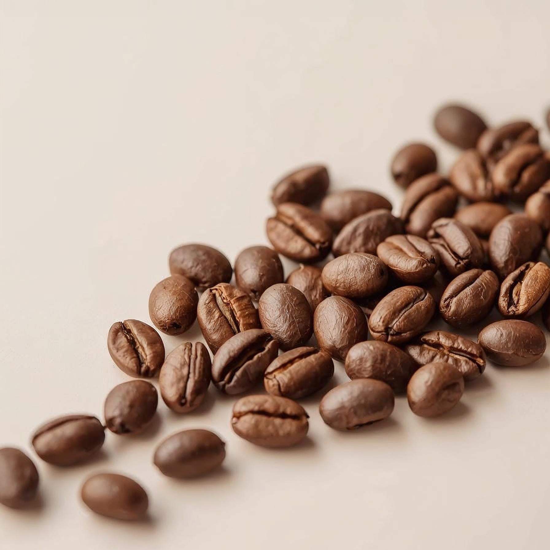 Roasted coffee beans on a beige background